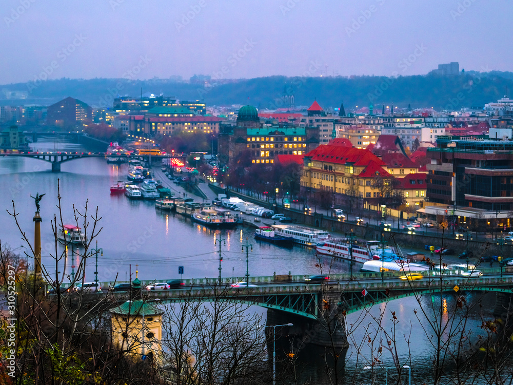 landscape image of the center of Prague with the Vltava river at evening