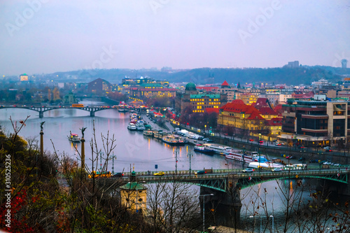 landscape image of the center of Prague with the Vltava river at evening