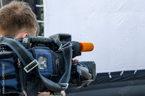 the cameraman make film captures the events on the street live television broadcast