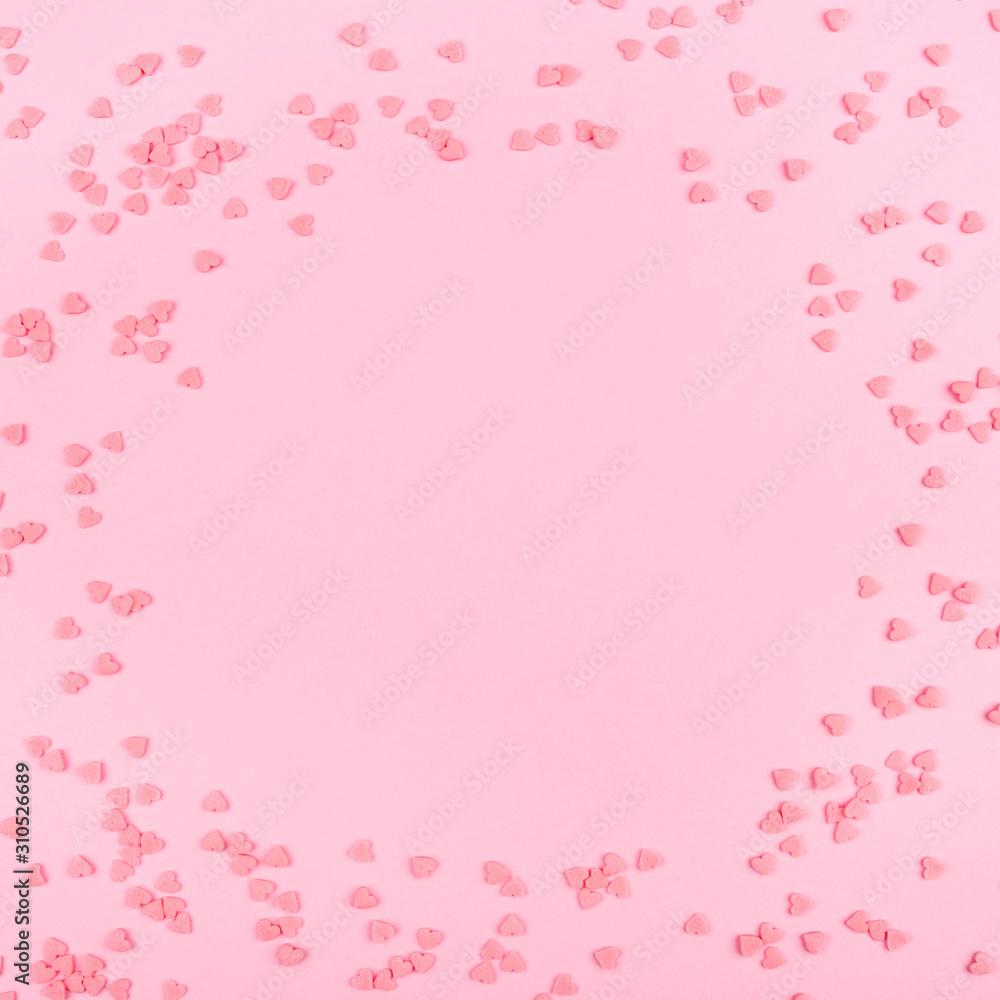 Pink background with tiny hearts. Valentine's day concept. Top view.