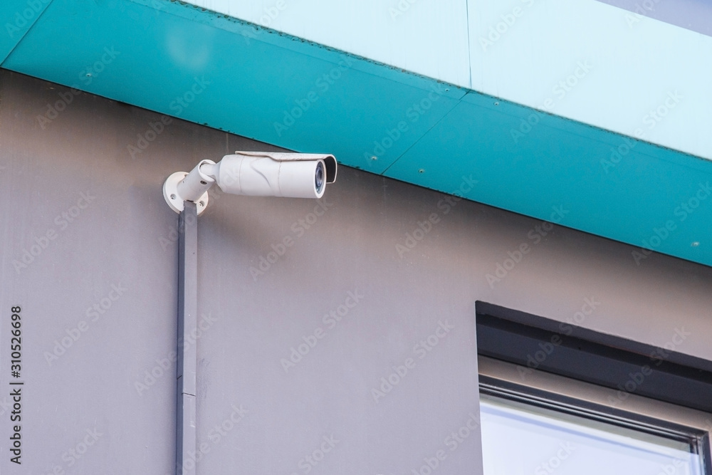 CCTV camera in front of a residential building CCTV camera in front of a residential building