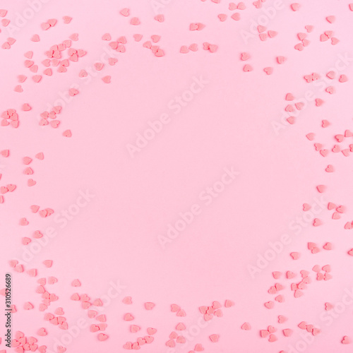 Pink background with tiny hearts. Valentine's day concept. Top view. © Anna