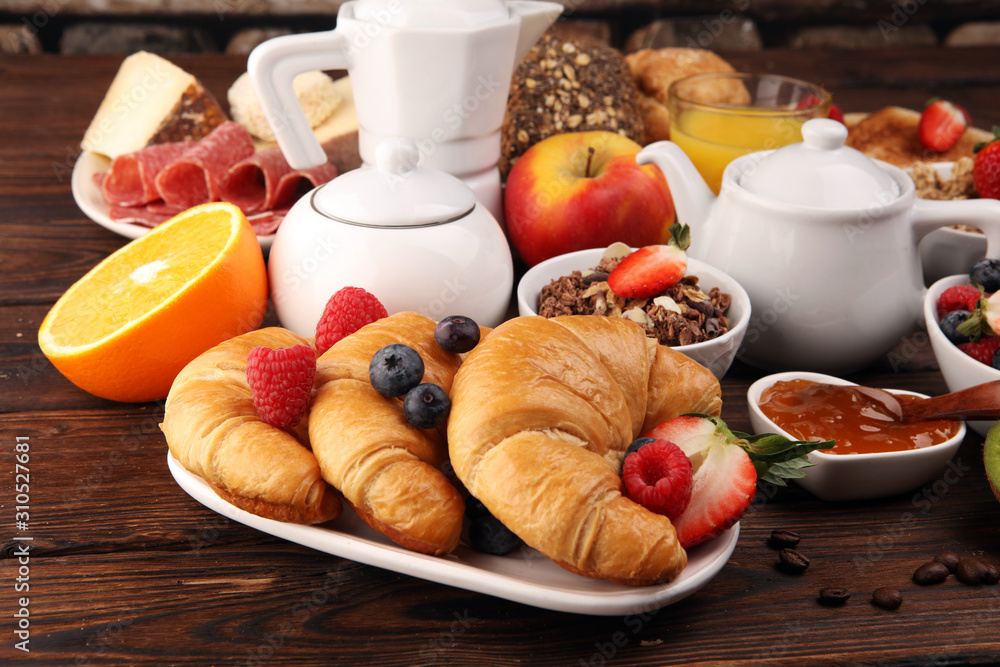 Breakfast served with coffee, orange juice, croissants, cereals and fruits. Balanced diet. Continental breakfast with granola and fruits Breakfast served with coffee, orange juice, croissants, cereals and fruits. Balanced diet. Continental breakfast with granola and fruits