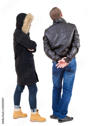 Back view of couple in winter jacket.