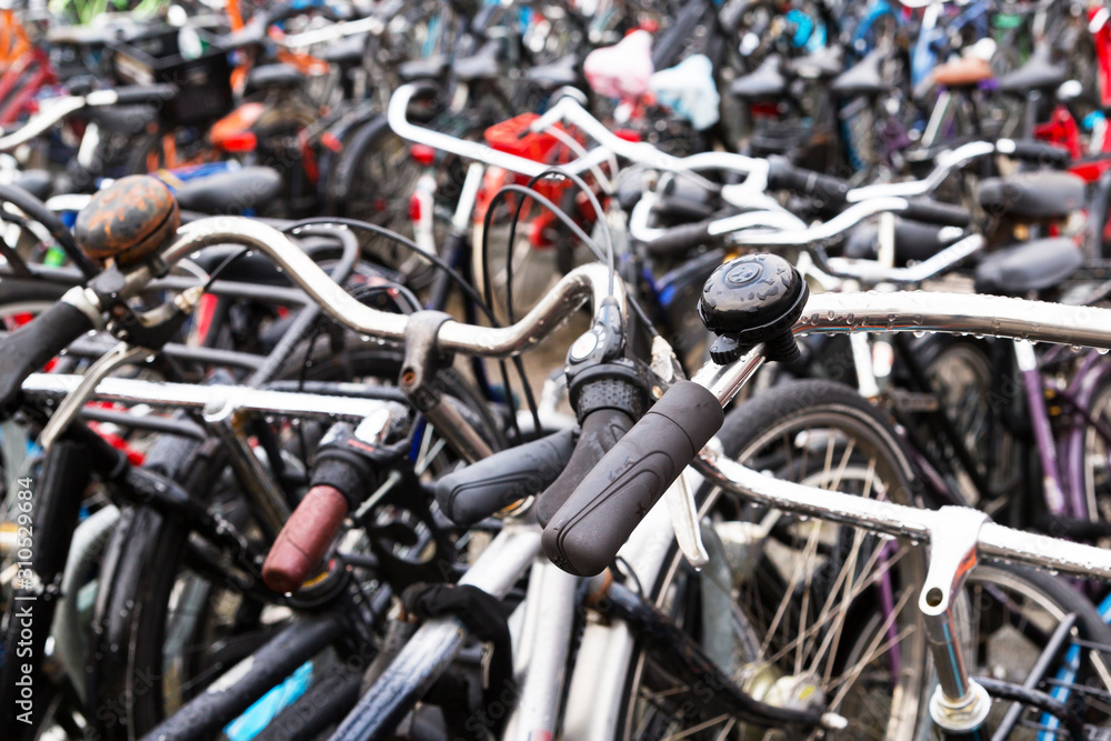 Bicycles parked outside Amsterdam Central Station. Close up one old bicycle