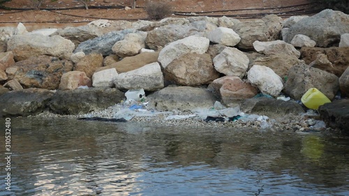 Garbage on the shore of the sory photo