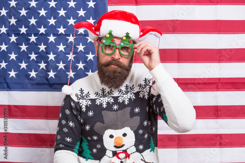 New year tradition in America. Bearded man on american flag. Celebrate xmas and new year in patriotic way. Festive tradition from USA. Respect american tradition. My freedom my tradition © be free