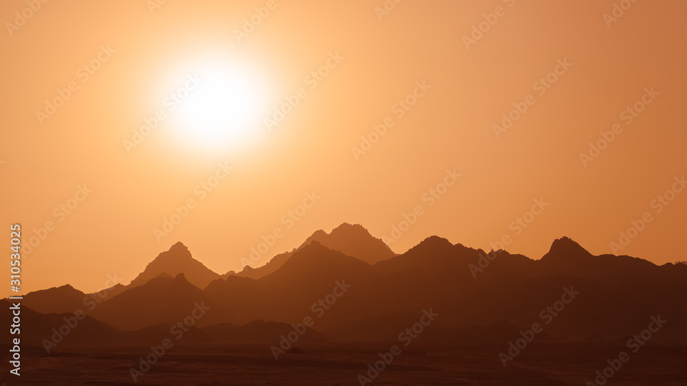 sun over mountain range, abstract
