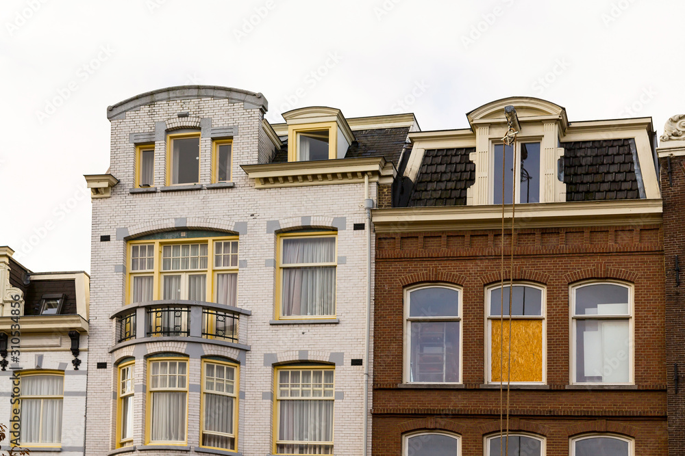 Fototapeta premium Amsterdam architecture features traditional white red house