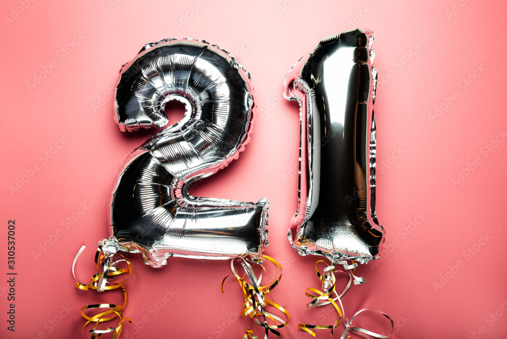 Balloon Bunting for celebration Happy 21th Anniversary made from Silver Number Balloons. Holiday Party Decoration or postcard concept with top view Balloon Bunting for celebration Happy 21th Anniversary made from Silver Number Balloons. Holiday Party Decoration or postcard concept with top view