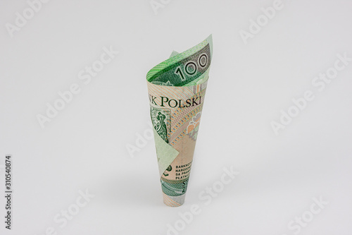 A one hundred Polish zloty banknote in the shape of a cone