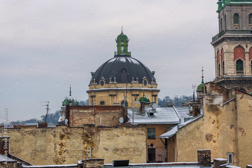 Aerial view of the Dominican church and monastery in Lviv, Ukraine. Winter cityscape. Dome of the cathedral and surrounding roofs Aerial view of the Dominican church and monastery in Lviv, Ukraine. Winter cityscape. Dome of the cathedral and surrounding roofs