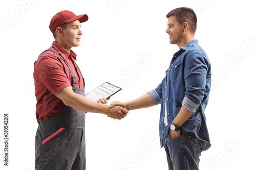 Male worker shaking hands with a young casual man