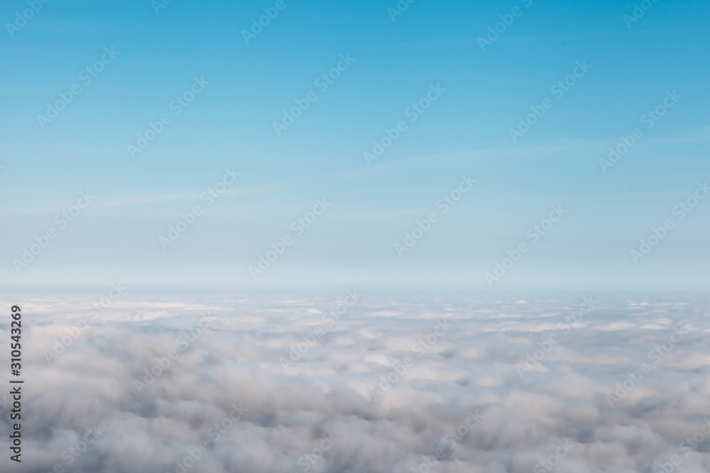 bird eye view at clouds in blue sky top view from drone from airplane window bird eye view at clouds in blue sky top view from drone from airplane window