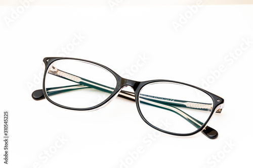 Folded fashion reading glasses for woman on white background