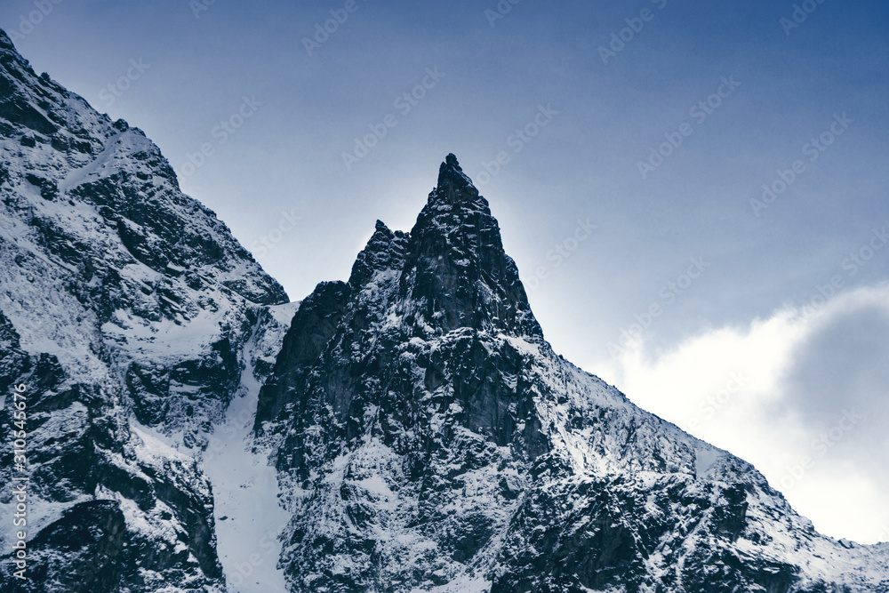 Landscape in the mountains. Beautiful peaks of snowy mountains