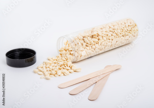 spa wax for depilation in granular form on the white background photo