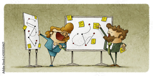 Work team talks while hanging on two panels notes and make diagrams.