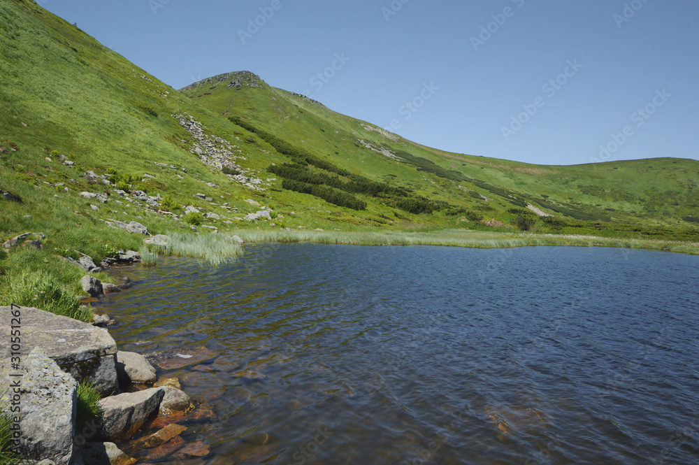 Small mountain lake in Ukrainian mountains.