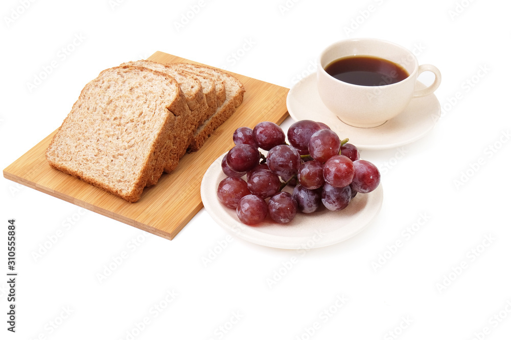 Whole grain bread and grapes serve with a cup of coffee isolated on white background.. Whole grain bread and grapes serve with a cup of coffee isolated on white background..