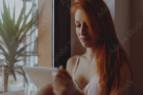 portrait of young woman with laptop