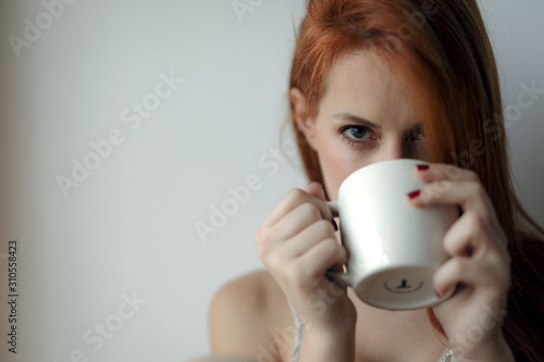 young woman drinking coffee