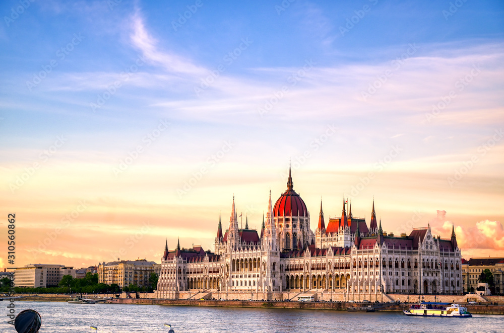 Fototapeta The Hungarian Parliament Building located on the Danube River in Budapest Hungary at sunset.