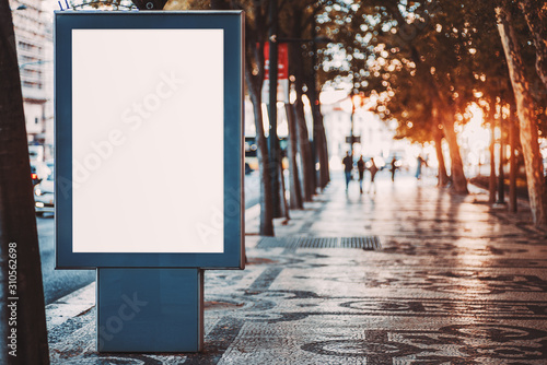 Foto Outdoor mockup of a blank information poster on patterned paving-stone; an empty