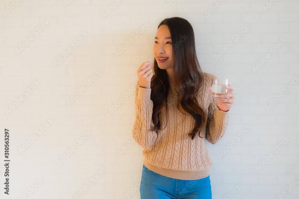 Portrait beautiful young asian women eat and take medicine or pill or vitamin Portrait beautiful young asian women eat and take medicine or pill or vitamin