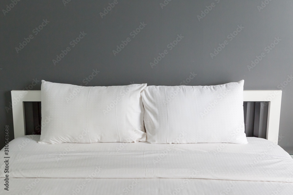 Two white pillow on bed and blanket Two white pillow on bed and blanket
