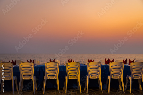Dining table at the beach during sunset