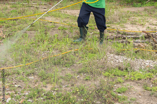 Spraying herbicide
