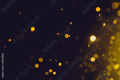 Abstract gold bokeh on black