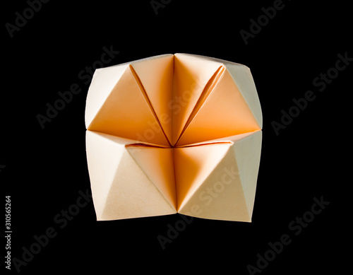 paper fortune teller isolated on black background.