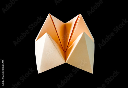 paper fortune teller isolated on black background. photo