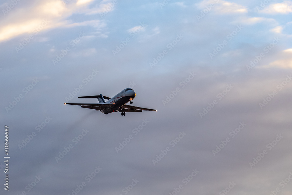 Jet airliner on approach at the airport Jet airliner on approach at the airport
