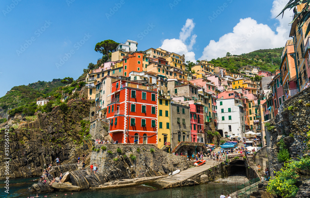 View at Riomaggiore village in Cinque Terre, Italy, with its traditional colorful houses and Ligurian Sea coast