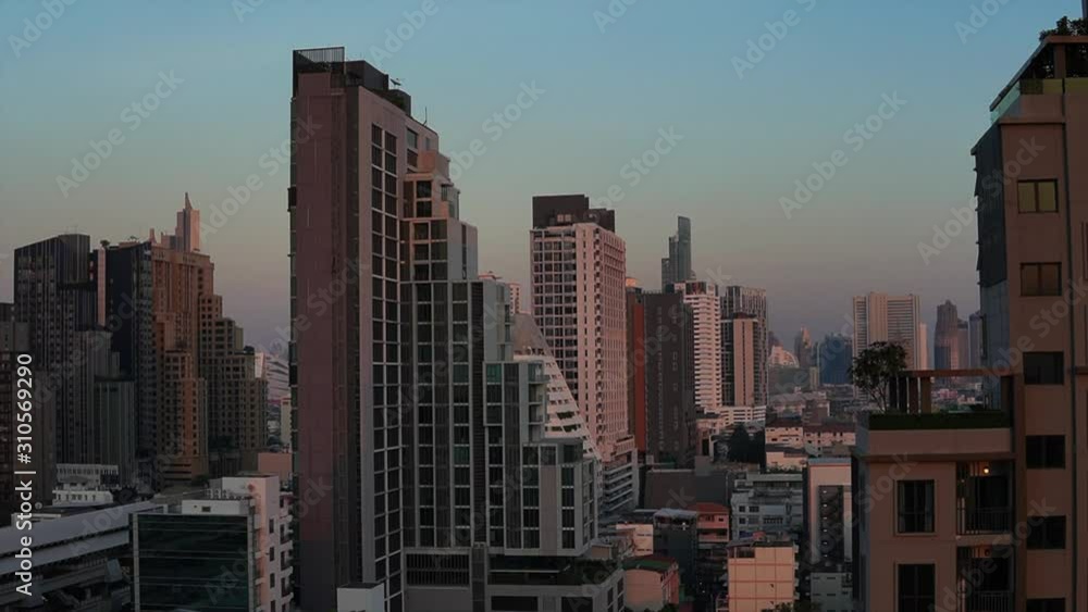 Stunning time-lapse sunset of downtown Bangkok leading up to full moon Stunning time-lapse sunset of downtown Bangkok leading up to full moon