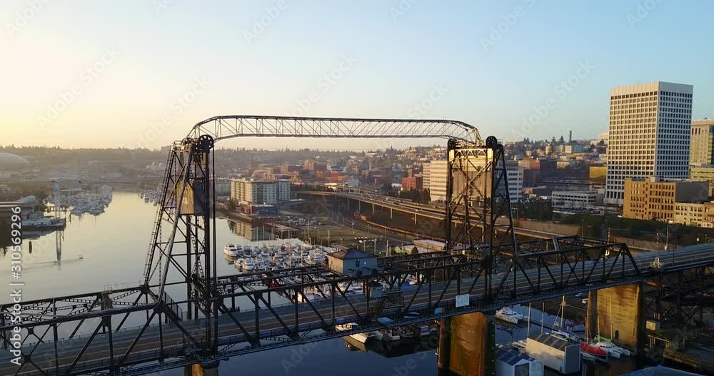 A Beautiful Scenery in Tacoma 11th St Bridge With Different Buildings and Calm Sea During Sunset - Aerial Shot A Beautiful Scenery in Tacoma 11th St Bridge With Different Buildings and Calm Sea During Sunset - Aerial Shot