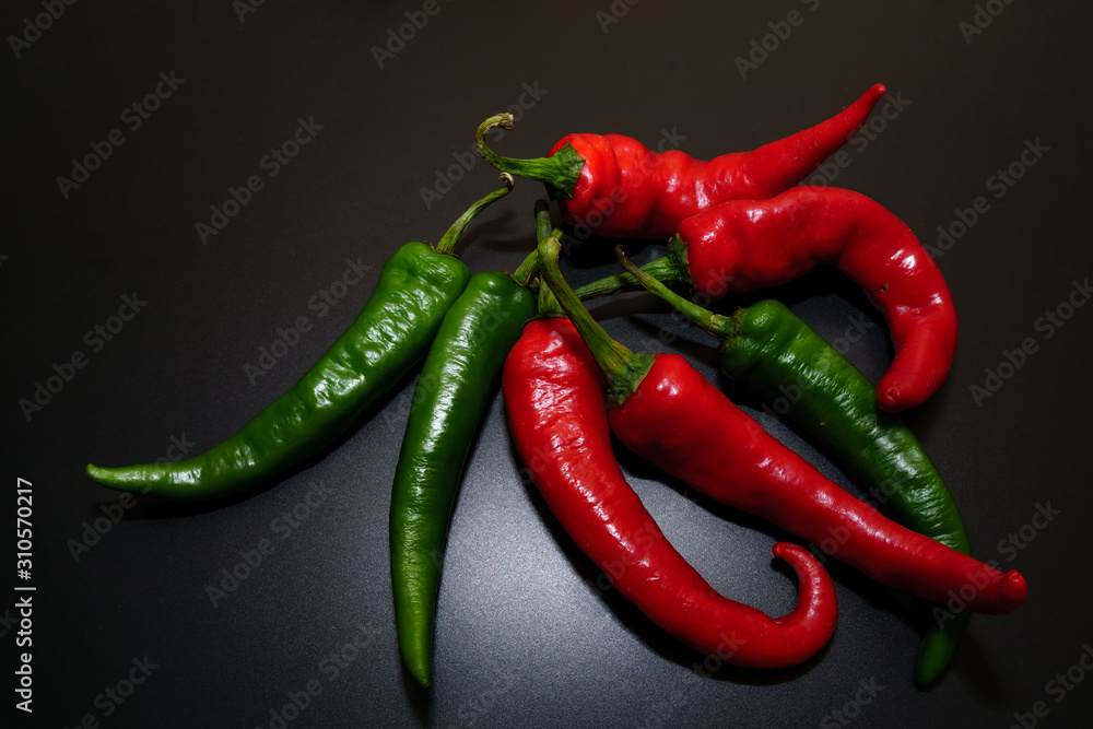 Chili peppers on a black background. Chili peppers on a black background.