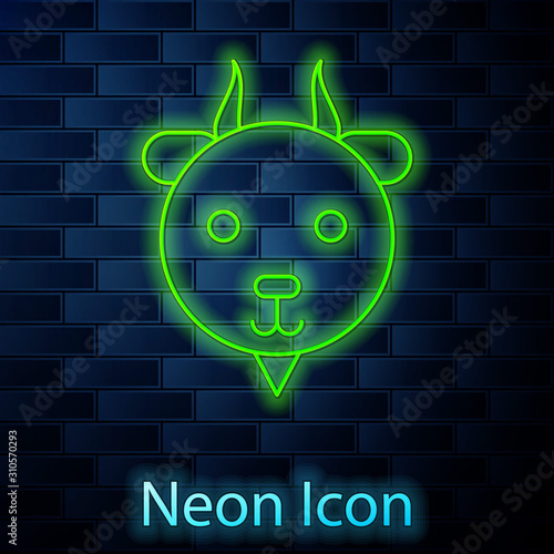Glowing neon line Aries zodiac sign icon isolated on brick wall background. Astrological horoscope collection. Vector Illustration
