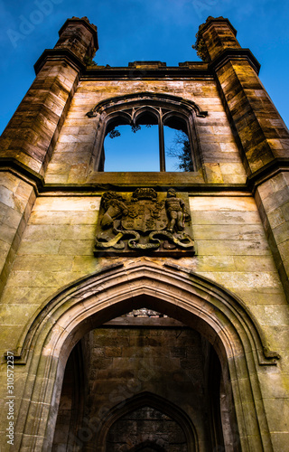 dunmore castle estate ruin. airth, falkirk, scotland. entrance to old castle with crest on wall. photo