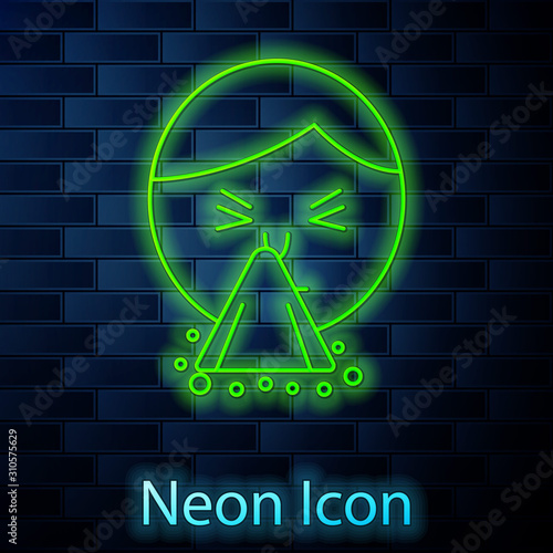 Glowing neon line Man holding handkerchief or napkin to his runny nose icon isolated on brick wall background. Coryza desease symptoms. Vector Illustration