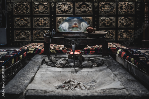 The rest place for Tibetan people with cauldron of tea in the middle