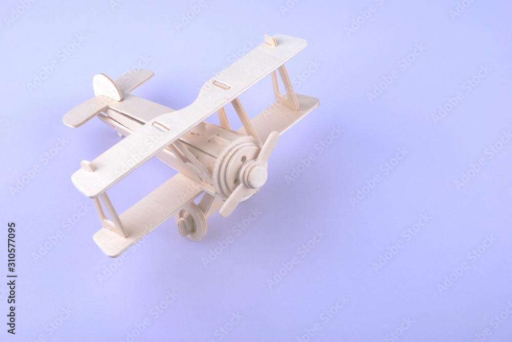 A wooden airplane model isolated on white background