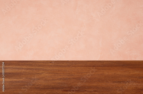 Empty wooden floors on pink wallpaper background