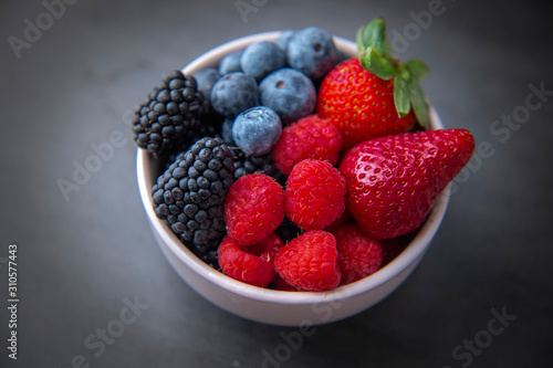 strawberries  blueberries  blackberries and raspberries in the bowl