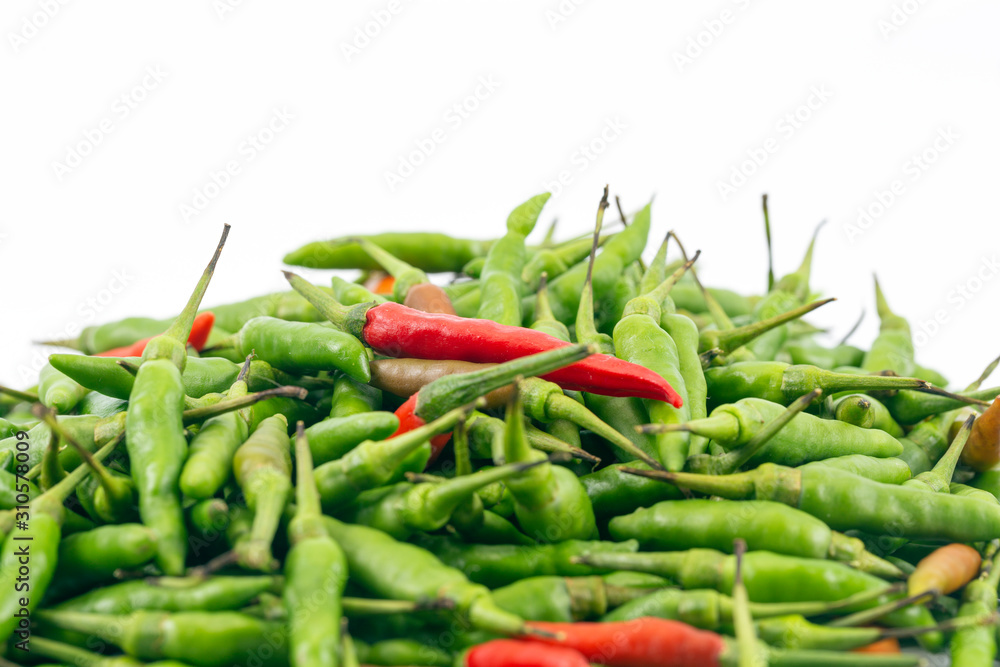 A fresh red and green bird-chilli with white space background A fresh red and green bird-chilli with white space background