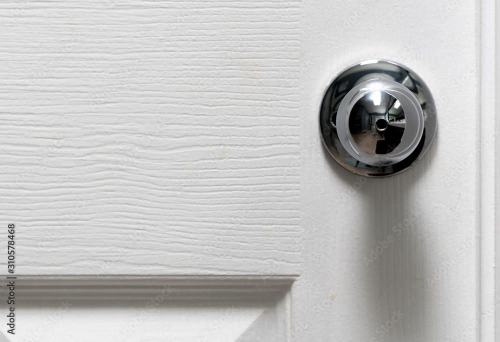 Silver Door Knob on white door , stainless steel round ball metallic door knob. Silver Door Knob on white door , stainless steel round ball metallic door knob.