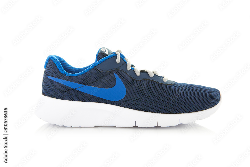 Nike Tanjun Trainers in blue, Taken at studio and isolated over a white  background Stock Photo | Adobe Stock